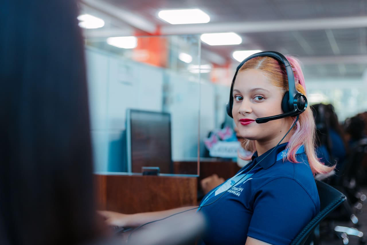 Agent with headset on the operations floor