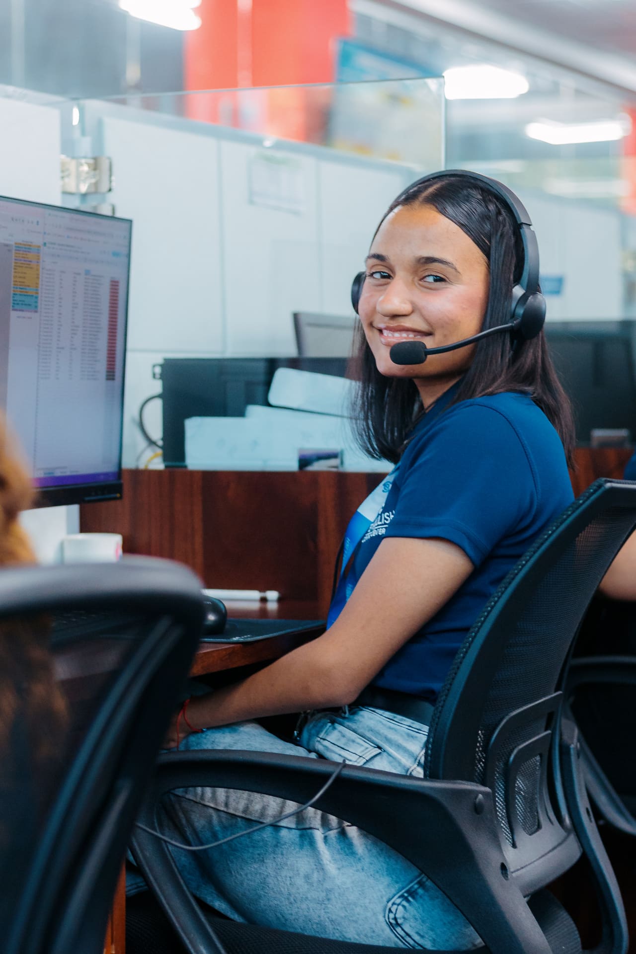 Agent smiling at her station